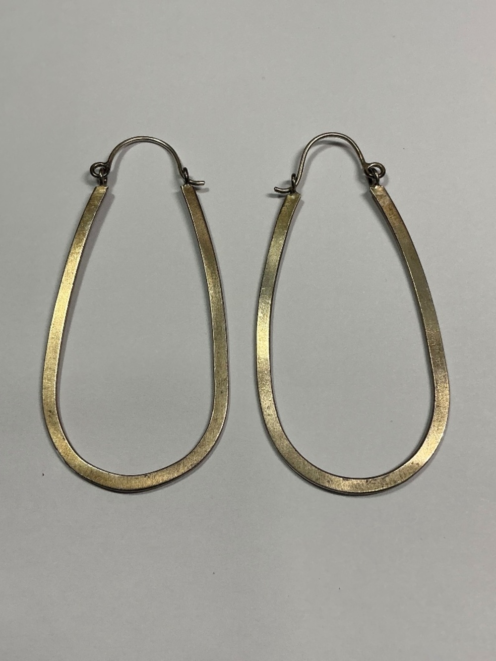 Sterling Silver Oval Shaped Hoop Earrings. 2 3/8 inches long